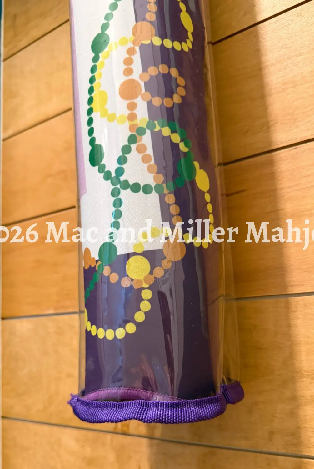 Close up view of the bottom of the Mac and Miller Mahjong Dream Display Mat Tote Bag in Plum
